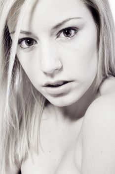 Studio portrait of a young blond woman being expressive