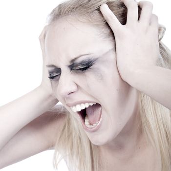 Studio portrait of a young blond woman screaming out loud