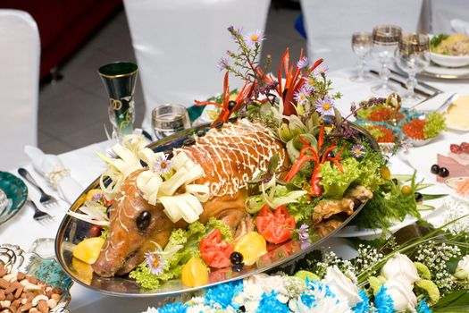 a dairy pig and tasty meal on a beautiful table