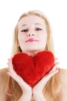 blond girl with a pilow-heart in hands