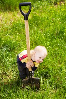 small girl ready to work in the garden