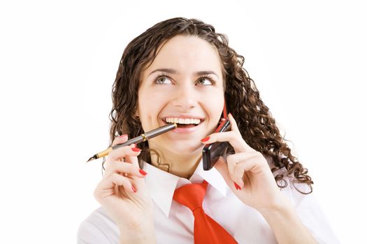 smiling girl with pen and mobile phone in hands