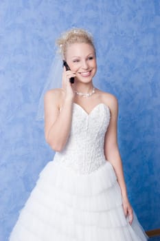 smiling bride calling by phone