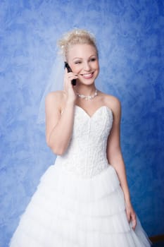 smiling bride calling by phone