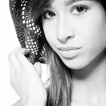 Studio portrait of a beautiful mixed race, vietnamese girl and her straw hat