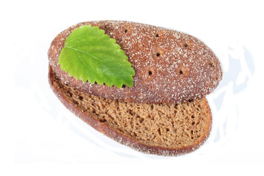 Isolated bread with green leaf