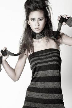 Studio portrait of a beautiful mixed race, vietnamese girl with her scarf