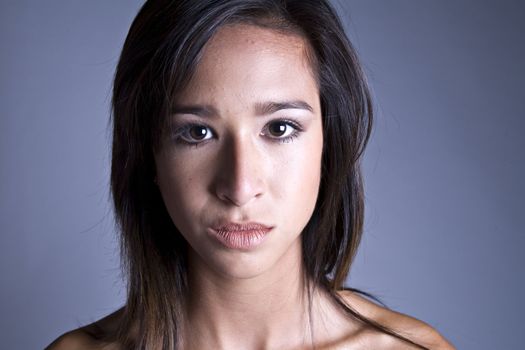 Studio portrait of a beautiful mixed race, vietnamese girl in a classical way