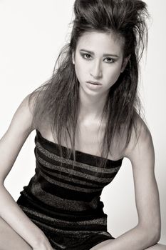 Studio portrait of a beautiful mixed race, vietnamese girl with high hair