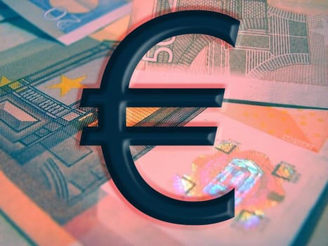 Euro mark and euro bancknotes at the background