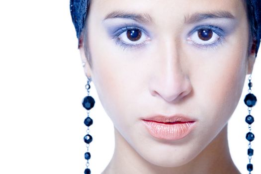 Studio portrait of a beautiful mixed race, vietnamese girl with earrings