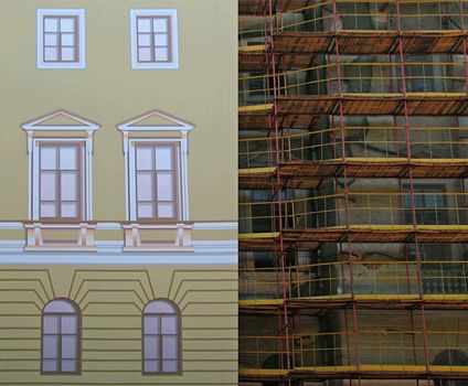 The scaffolding and the false front of a house under reconstruction