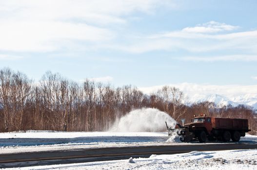 Snowplow removing snow from the intercity road