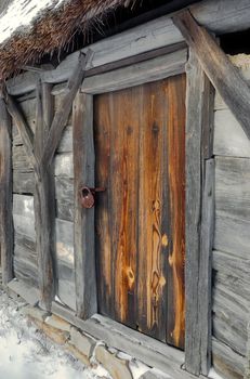 Authentic vintage wooden door on original log cabin