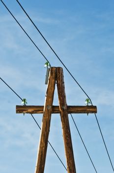 Electric column with wires against the dark blue sky