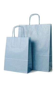 Blue shopping paper bags on white background.