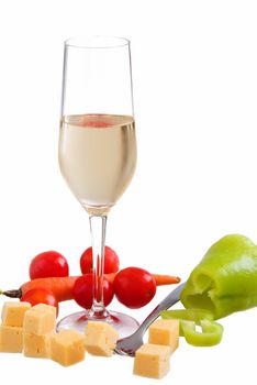 Glass of white wine with various types of cheese and garnishes on a white background