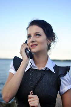 girl with a telephone receiver in hand, space for text