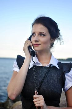 girl with a telephone receiver in hand, space for text