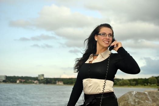 girl with a telephone receiver in hand, space for text