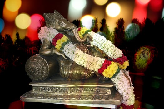 A beautifully decorated metallic idol of hindu lord Ganesha.