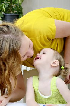 daughter kissing her mother