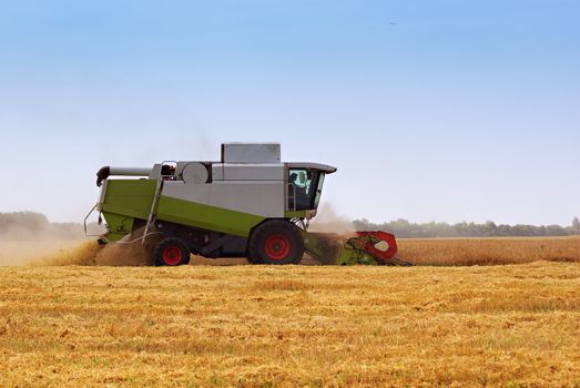 Big  combine working on the Wheat field