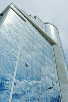 clouds reflected in the windows of the building