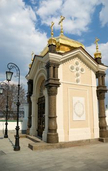 small aging russian chapel on background cloudy sky