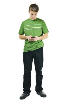 Young man texting on cellphone standing full body isolated on white background