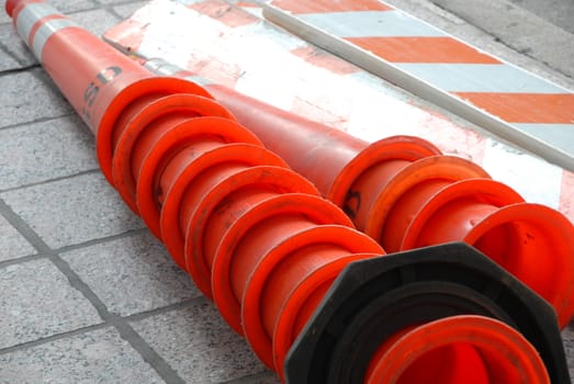 Orange traffic cones ready for use.