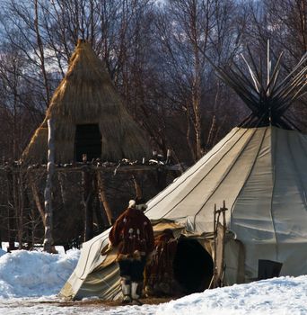 Aboriginals of the north coming into a hut