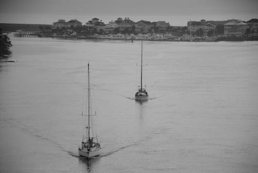 Two ships heading out for the day along the intercoastal waterway