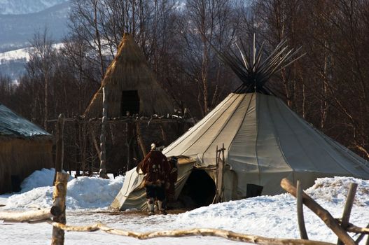 Aboriginals of the north coming into a hut