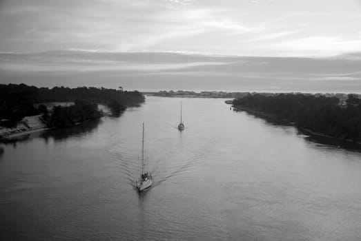 Two ships heading out for the day along the intercoastal waterway