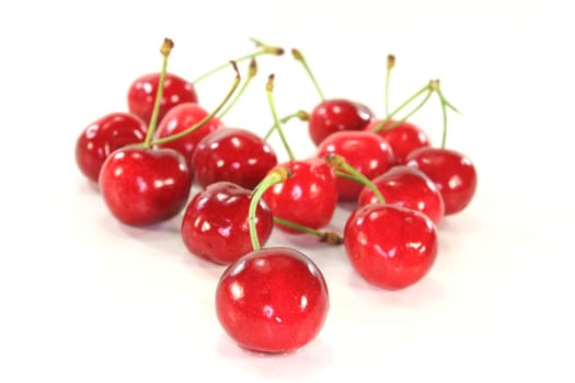 fresh red cherries on a white background