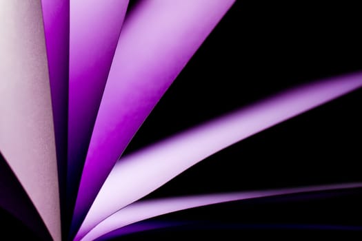 purple notepad paper illuminated by LED lights from lower left in landscape orientation