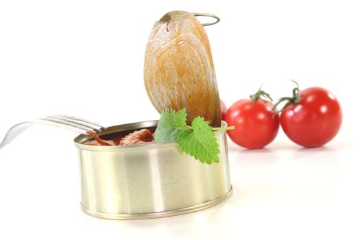 a can of musk octopus with lemon balm on white background