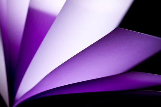 purple notepad paper illuminated by LED lights arise from lower left in landscape orientation