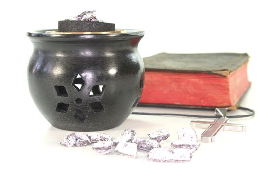 frankincense with incense censer and Bible on a white background