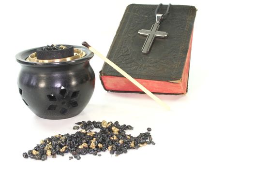 frankincense with incense censer and Bible on a white background