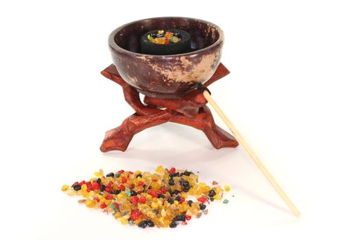 colorful frankincense with incense censer on a white background