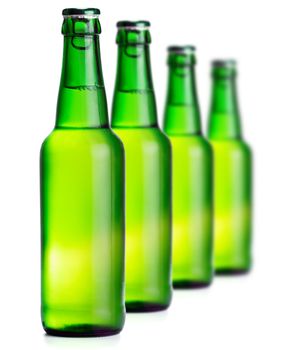 Green beer bottles on the white background