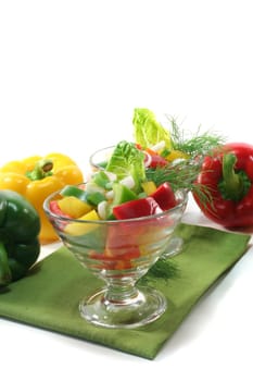 colorful bell pepper salad with dill in small glass bowl