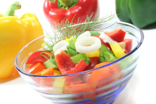 colorful bell pepper salad with dill in small glass bowl