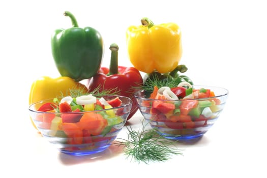 colorful bell pepper salad with dill in small glass bowl