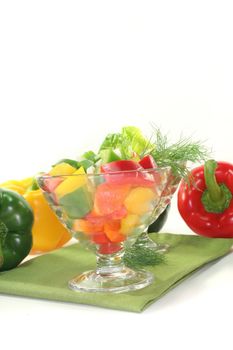 colorful bell pepper salad with dill in small glass bowl