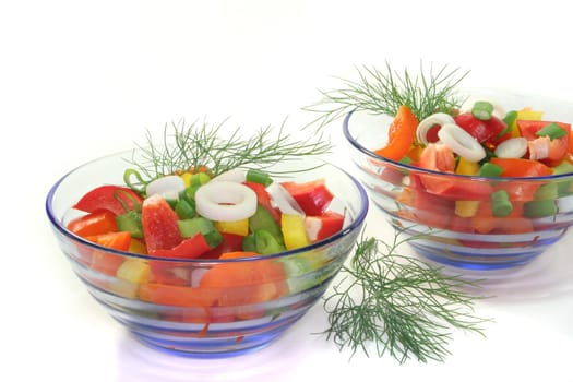 colorful bell pepper salad with dill in small glass bowl