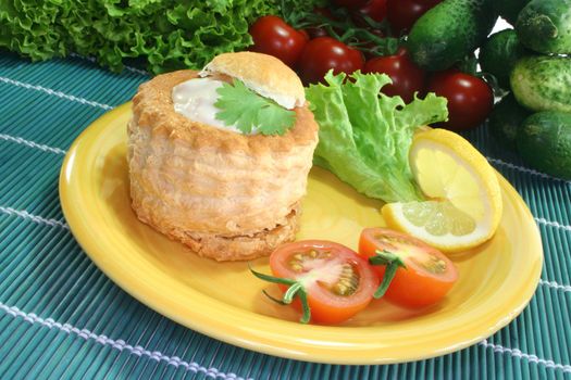 Queen pie filled with chicken ragout and fresh herbs