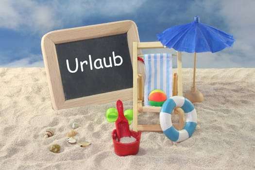 School board and toys on a sandy beach